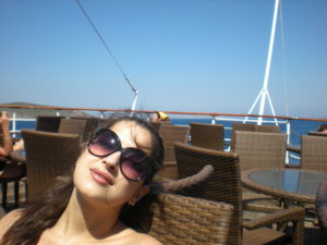 life turning point on Patmos-dina al hidiq zebib sitting on cruise ship deck