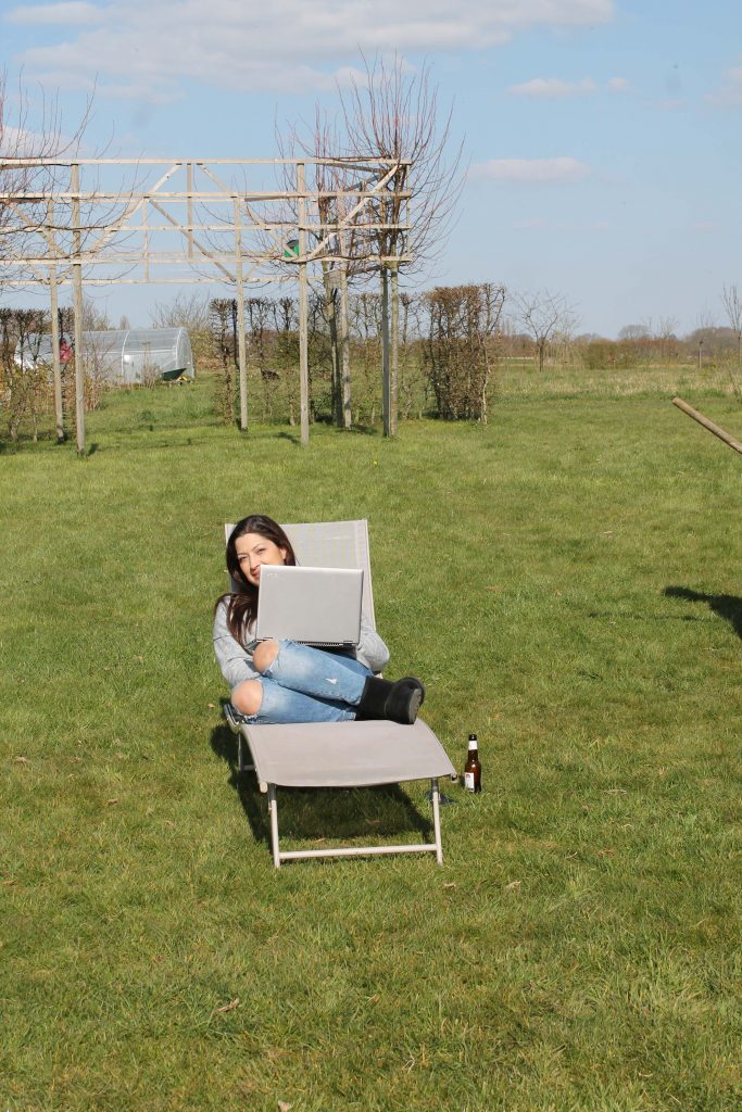 Sitting and writing in my garden in Belgium